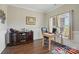 Office space includes a desk, cabinet, and a window for natural light, making it an ideal work environment at 3013 Isle Ln, Monroe, NC 28110