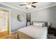 Serene bedroom with modern decor, and view to the ensuite bathroom at 303 Caroline Ave, Lowell, NC 28098