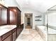 Large primary bathroom with double vanity, separate tub, and a shower with glass enclosure at 3057 Drummond Ave, Indian Land, SC 29707
