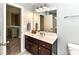 Bathroom featuring a dark wood vanity with ample counter space and a well-lit mirror at 3057 Drummond Ave, Indian Land, SC 29707