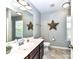 Bathroom with natural light, decorative star accents, and ample vanity space at 3057 Drummond Ave, Indian Land, SC 29707