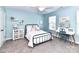 Bright bedroom features a black metal bedframe, accent furniture, and plentiful natural light at 3057 Drummond Ave, Indian Land, SC 29707