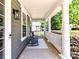 Inviting front porch with comfortable seating, perfect for relaxing and enjoying the outdoors at 3057 Drummond Ave, Indian Land, SC 29707