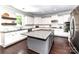 Bright kitchen features an island, stainless steel appliances, and white cabinets with granite countertops at 3057 Drummond Ave, Indian Land, SC 29707