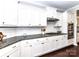 Modern kitchen with white cabinets, stainless steel appliances, and granite countertops offers gas stovetop at 3057 Drummond Ave, Indian Land, SC 29707