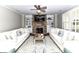 Cozy living room has a ceiling fan and a beautiful stone fireplace with built-in shelving at 3057 Drummond Ave, Indian Land, SC 29707