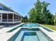Backyard features a luxury pool with a hot tub and an outdoor entertainment area at 3057 Drummond Ave, Indian Land, SC 29707