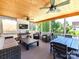 Spacious screened porch with a wood ceiling and multiple seating areas is perfect for entertaining at 3057 Drummond Ave, Indian Land, SC 29707