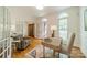 Bright home office with hardwood floors, white trim, and arched windows at 3233 Sunnymede Ln, Charlotte, NC 28209