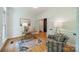 Comfortable home office featuring light walls, hardwood flooring, and modern furnishings at 3233 Sunnymede Ln, Charlotte, NC 28209