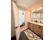 Bright en-suite bath with double vanity, sleek fixtures, and access to the bedroom at 3317 Sargeant Dr, Charlotte, NC 28217