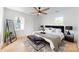 Well-lit main bedroom with large windows, hardwood floors, and stylish modern decor at 3317 Sargeant Dr, Charlotte, NC 28217