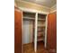 Bedroom closet featuring wood shelving and ample storage space at 36 Maple Ave, Gastonia, NC 28054