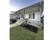 Charming curb appeal of this home's landscaped front yard and covered porch at 36 Maple Ave, Gastonia, NC 28054