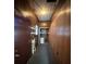 Functional hallway features wood paneled walls and a closet with a water heater at 36 Maple Ave, Gastonia, NC 28054