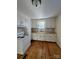 Bright kitchen featuring white cabinetry, white subway tile, and wood flooring at 36 Maple Ave, Gastonia, NC 28054