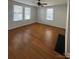 Bright living room with hardwood floors and three large windows at 36 Maple Ave, Gastonia, NC 28054