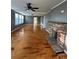 Spacious living room with hardwood floors, brick fireplace, and plenty of natural light at 36 Maple Ave, Gastonia, NC 28054