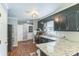 Modern kitchen featuring stainless steel appliances, dark cabinetry, and granite countertops at 3619 Baywoods Ct, Gastonia, NC 28056