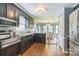 Modern kitchen featuring stainless steel appliances, dark cabinetry, and an open layout at 3619 Baywoods Ct, Gastonia, NC 28056