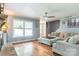 Inviting living room with hardwood floors, a brick fireplace, and comfortable seating at 3619 Baywoods Ct, Gastonia, NC 28056