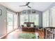 Bright sun room with ample windows, hardwood floors, and a comfortable seating area at 3619 Baywoods Ct, Gastonia, NC 28056