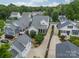 Aerial view of a neighborhood showcasing well-maintained homes and lush landscaping at 365 Delburg St, Davidson, NC 28036