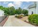 Landscaped backyard with mature trees and a patio area perfect for entertaining at 365 Delburg St, Davidson, NC 28036