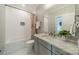 Updated bathroom features subway tile, marble countertop, and modern fixtures at 365 Delburg St, Davidson, NC 28036
