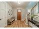 Inviting foyer featuring hardwood floors, staircase with iron railing and plenty of natural light at 365 Delburg St, Davidson, NC 28036