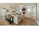 Comfortable living room featuring a brick fireplace, ceiling fan and neutral colored decor at 365 Delburg St, Davidson, NC 28036