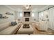 Inviting living room with a brick fireplace, wooden floors, and neutral-toned furniture at 365 Delburg St, Davidson, NC 28036