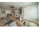Open concept living room with hardwood floors, a foosball table, and neutral decor at 365 Delburg St, Davidson, NC 28036