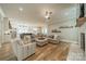 Open-concept design showcasing the living room, kitchen, and dining area at 365 Delburg St, Davidson, NC 28036