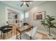 Office space with a desk, white chair, and view into the adjoining living room at 365 Delburg St, Davidson, NC 28036