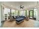 Cozy sunroom with large windows, comfortable seating, and natural light at 365 Delburg St, Davidson, NC 28036