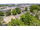 An aerial shot shows homes near new construction and a city skyline at 3919 Sarah Dr # 14, Charlotte, NC 28217