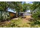 Large backyard features mature trees and a detached garage for outdoor activities and storage at 3919 Sarah Dr # 14, Charlotte, NC 28217