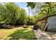 Expansive backyard features mature trees, providing a serene and private outdoor space at 3919 Sarah Dr # 14, Charlotte, NC 28217