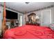 Bright bedroom featuring a four-poster bed, dresser, and a modern aesthetic at 3919 Sarah Dr # 14, Charlotte, NC 28217