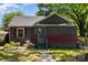 Charming single-story home featuring a screened-in porch, cozy curb appeal and sidewalk leading up to the front door at 3919 Sarah Dr # 14, Charlotte, NC 28217