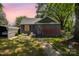 Charming single-story home featuring a screened-in porch, cozy curb appeal and sidewalk leading up to the front door at 3919 Sarah Dr # 14, Charlotte, NC 28217