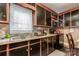 Kitchen with a double sink, tile backsplash, and black appliances at 3919 Sarah Dr # 14, Charlotte, NC 28217