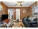 Comfortable living room with wood paneled walls provides a relaxing space with ample seating at 3919 Sarah Dr # 14, Charlotte, NC 28217