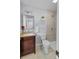 Cozy bathroom offers a warm vanity with plenty of drawers and a tiled shower at 4009 Dunwoody Dr, Charlotte, NC 28215