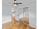 Bright bedroom with mirror closet doors and hardwood floors at 4009 Dunwoody Dr, Charlotte, NC 28215