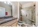 Beautiful bathroom with a glass shower, granite vanity, and tile flooring at 4015 Broadview Ln, Gastonia, NC 28056