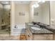 A luxurious bathroom features double sinks, a bath, and a glass shower at 4015 Broadview Ln, Gastonia, NC 28056