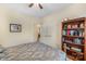 This bedroom features a ceiling fan, closet, and a bookshelf at 4015 Broadview Ln, Gastonia, NC 28056