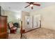This spacious bedroom includes a desk, rocking chair, and closet at 4015 Broadview Ln, Gastonia, NC 28056